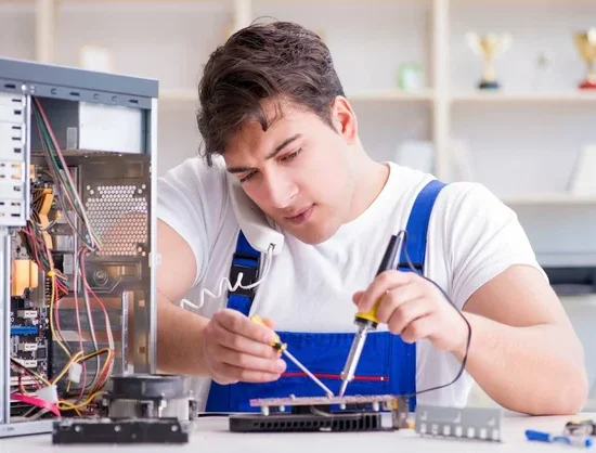depositphotos_417475314-stock-photo-computer-repairman-repairing-desktop-computer